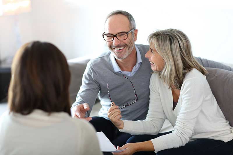 Couple meeting with their accountant to discuss tax preparation.